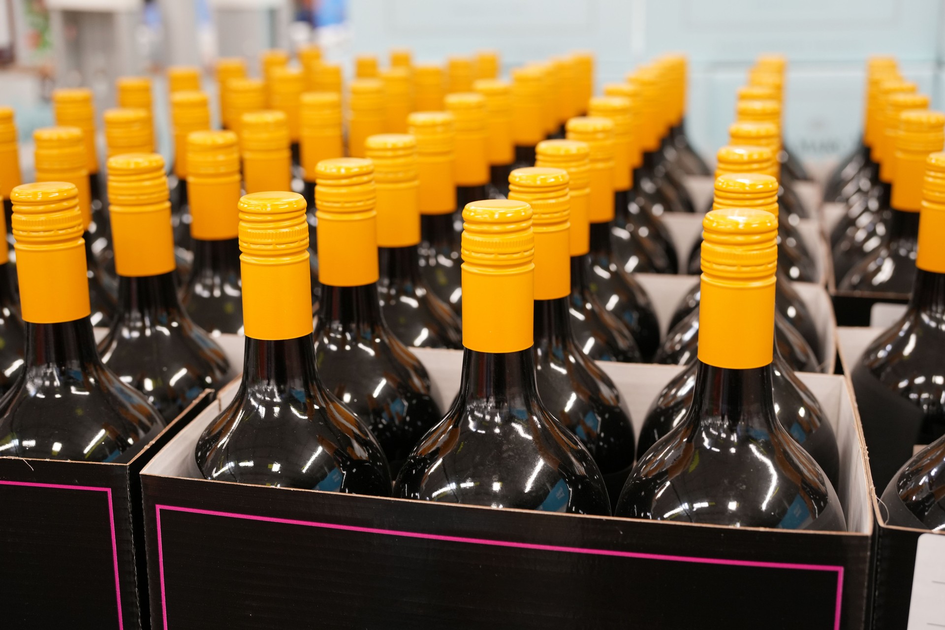 wine bottles with screw caps in container