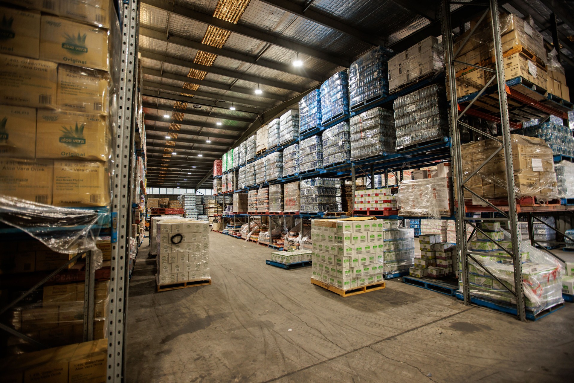 Warehouse with Rows of Shelves and Stocked Merchandise