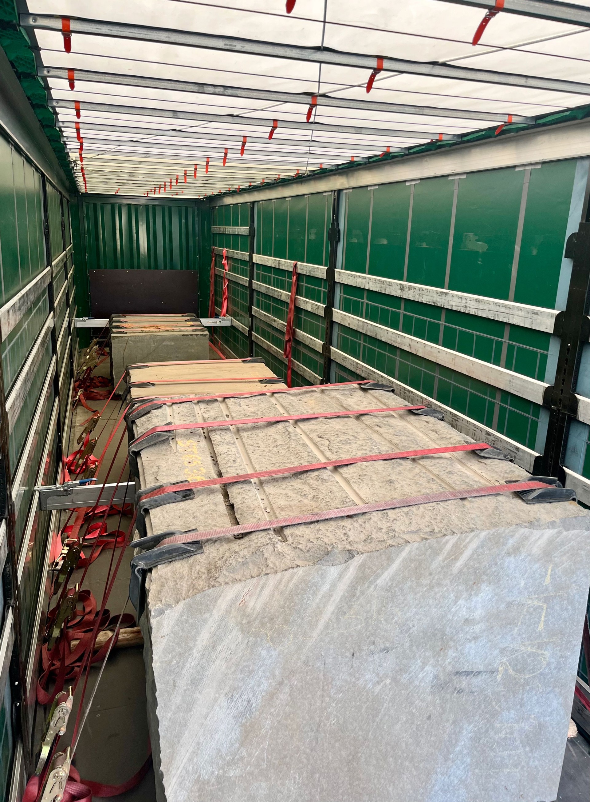 Transportation of granite stones in a semi-trailer. Semi-trailer with granite