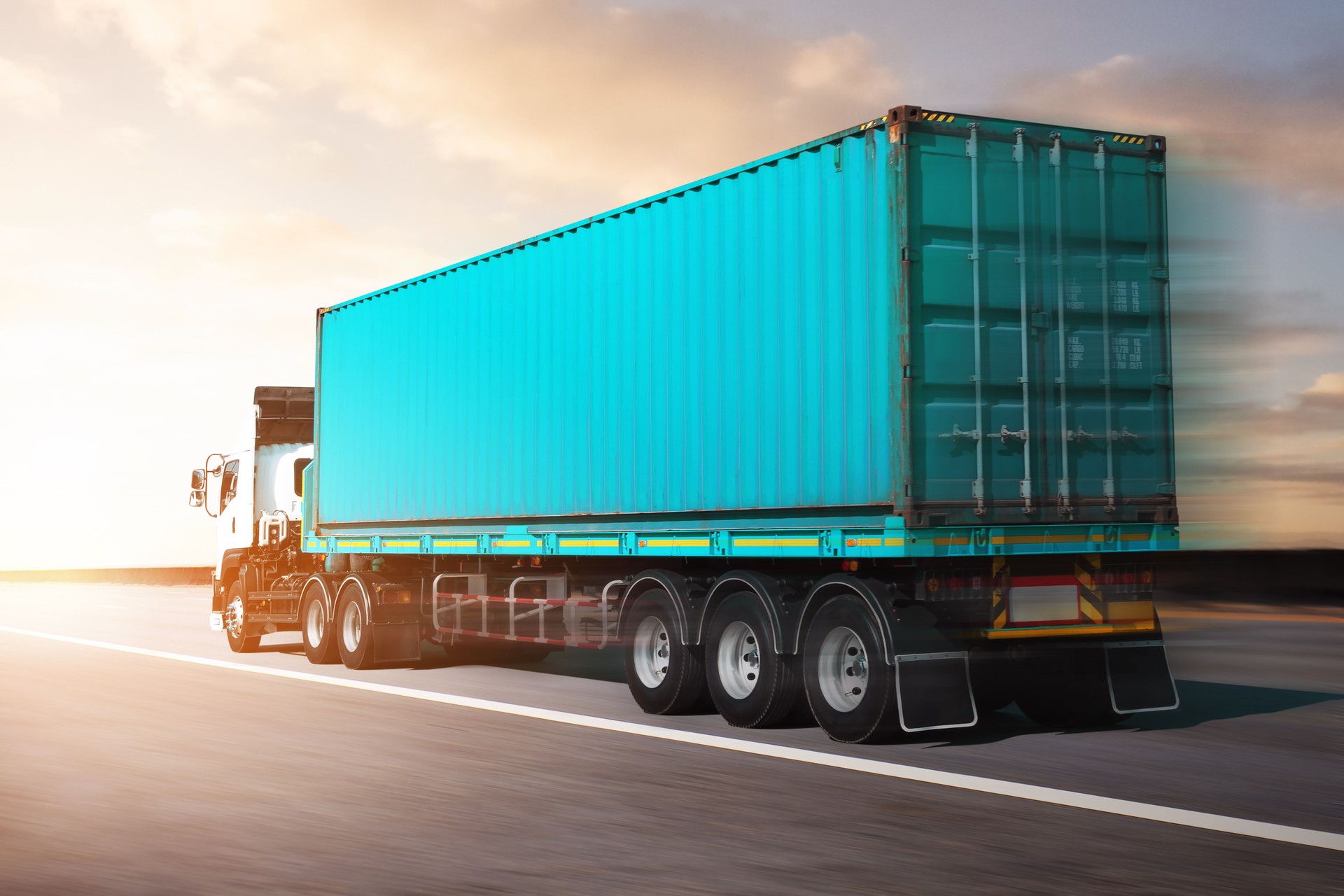 Fast Motion of Semi Trailer Truck Driving on The Road. Shipping Cargo Container. Economy Business Transport on Road. Shipping Import- Export. Trucking. Freight Logistics Truck Transportation