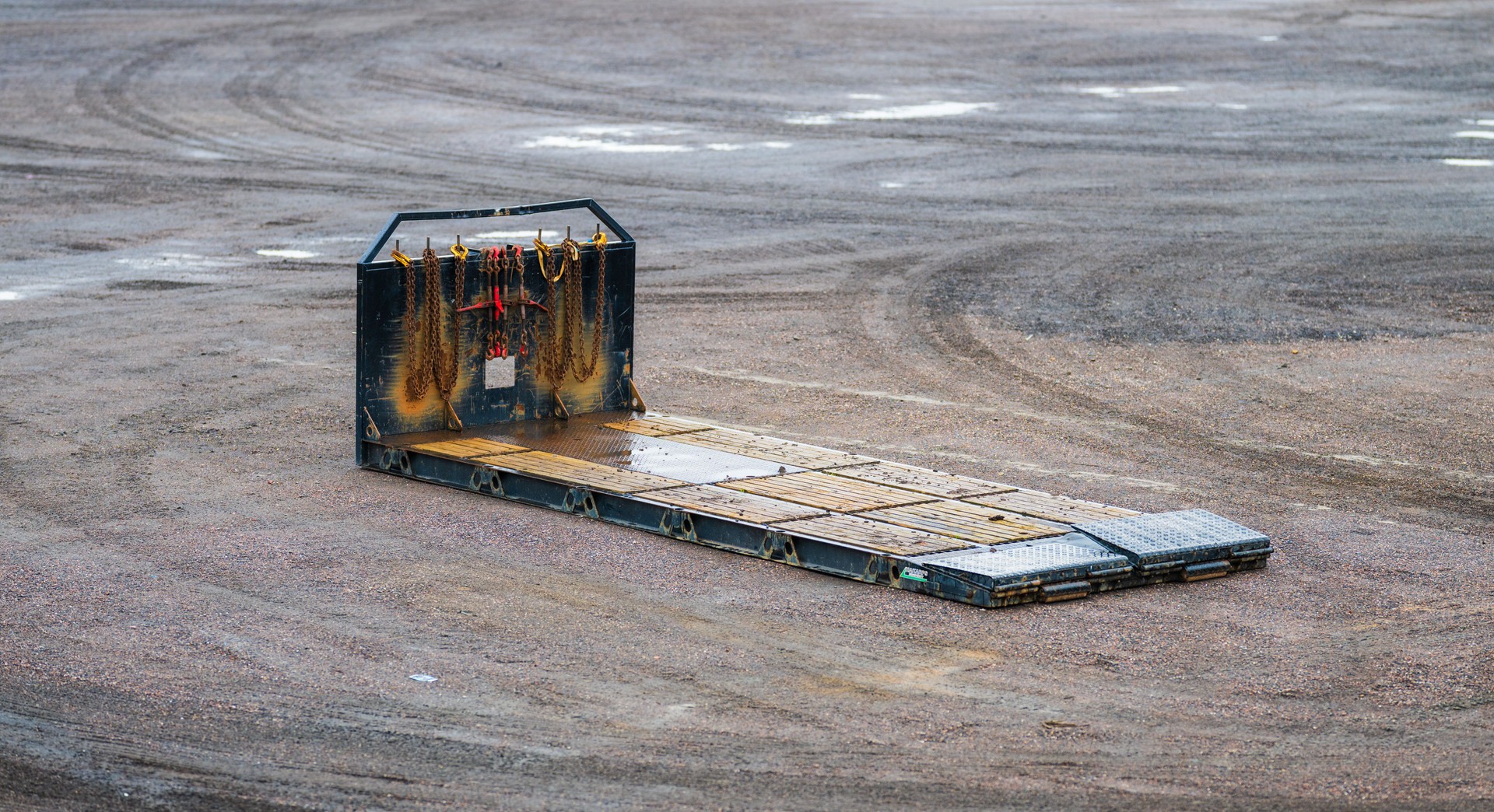 Cargo loading ramp on a gravel field.